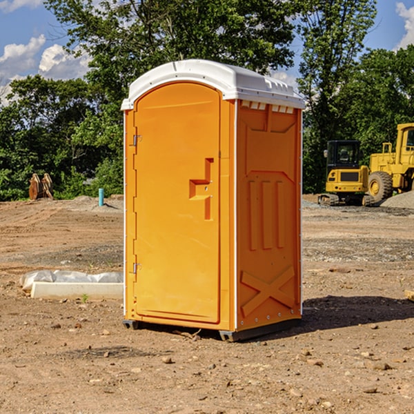 what is the cost difference between standard and deluxe portable restroom rentals in Rippey